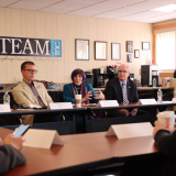 Rosa sitting at a round table with advocates talking about the importance of clean and renewable American energy