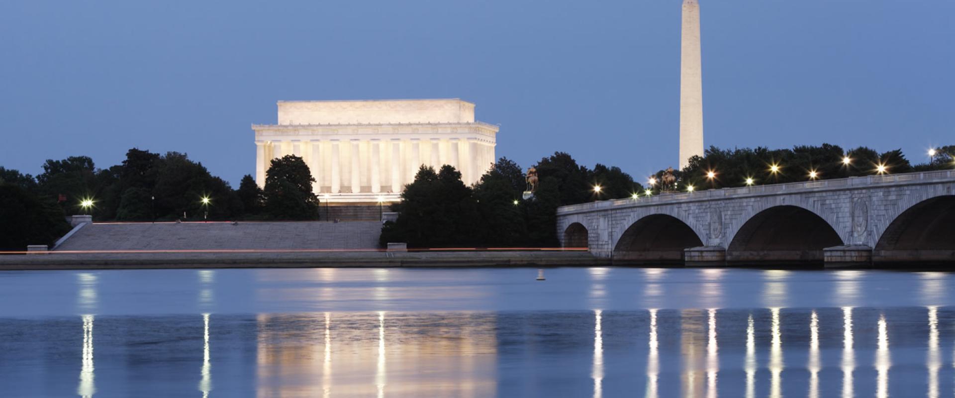Monuments and Potomac River at night