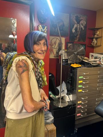 Rosa DeLauro with a tattoo of a swallow