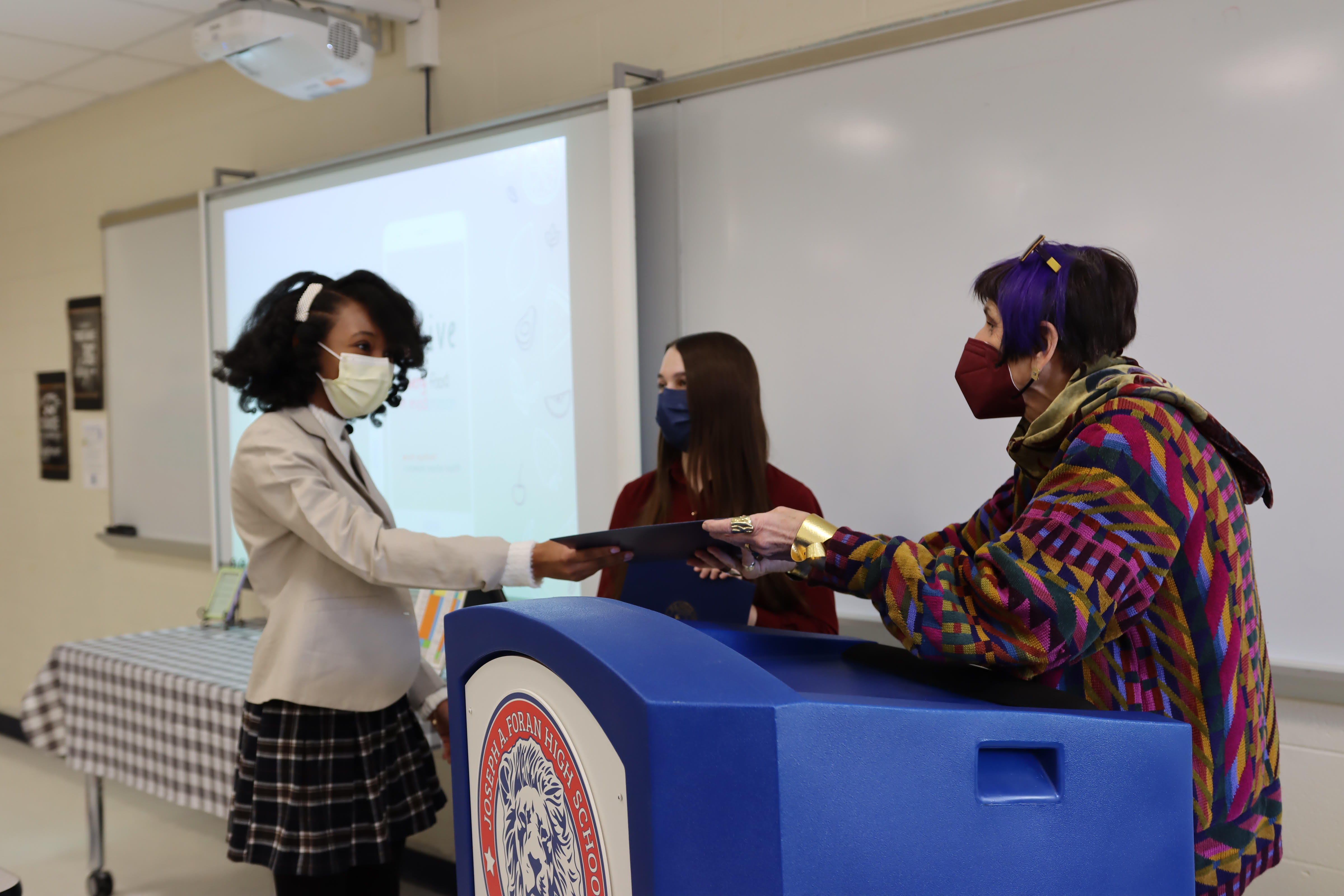 Leighla-Marie Dantes and Violet Wilson receive award from Congresswoman Rosa DeLauro 
