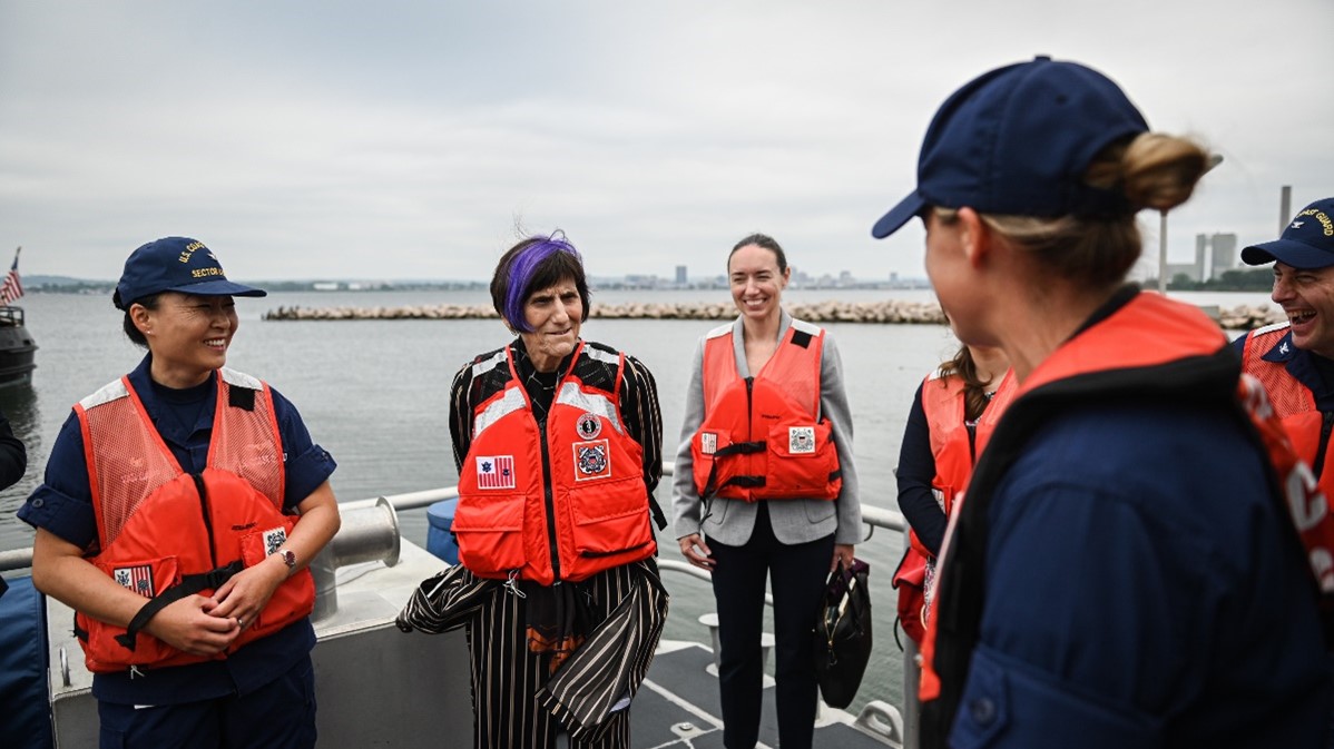 Captain Van Camp and Chair DeLauro Speak with Members of USCG